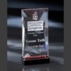 Crystal trophy award with engraved ship logo on black base, ideal for corporate or employee recognition achievements.