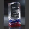 Crystal trophy with Comcast Direct Sales Quarter Club engraving, presented for corporate achievement on red and blue glass base.