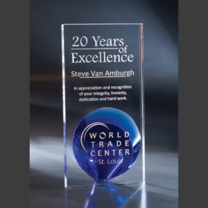 Crystal trophy with blue globe, engraved for 20 years excellence corporate milestone and achievement recognition.