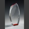 Crystal award trophy with smooth curved edges, red accents, ideal for corporate recognition or achievement presentations.