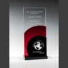 Crystal glass award with red accent, black base, and globe engraving; ideal for corporate or employee recognition.