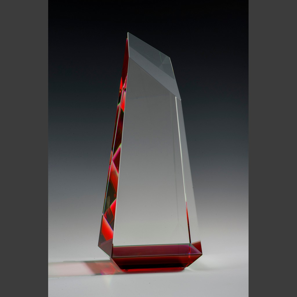 Crystal trophy with red liquid accent, ideal for corporate recognition or employee achievement awards.