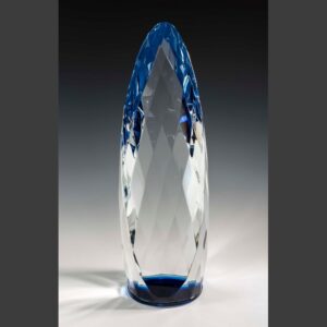Blue crystal trophy with faceted, elongated oval shape and clear body, ideal for corporate recognition or achievement awards.