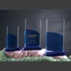 Set of three glass and blue acrylic crystal awards, ideal for corporate recognition or milestone achievements.