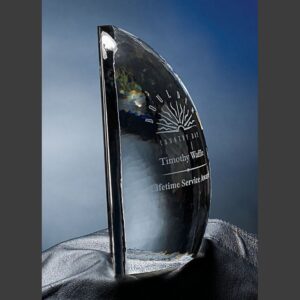 Semi-circular crystal trophy on black cloth, etched for Lifetime Service Award—ideal for corporate or employee recognition.