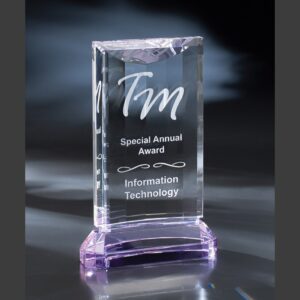 Rectangular crystal award with beveled edges and purple base, engraved for IT achievement, ideal for corporate recognition.