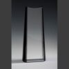 Clear crystal trophy with curved sides and black border displayed on a light surface; ideal for corporate achievement awards.