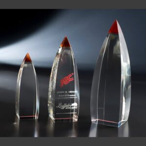 Vetri crystal trophies with red accents in three sizes; ideal for corporate recognition or achievement awards.