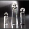 Crystal awards, including the Discovery Crystal Trophy, displayed for corporate or employee recognition.