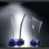 Epiphany Crystal trophy awards with curved design on blue bases, ideal for corporate or employee recognition.