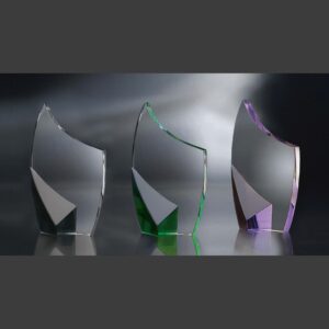 Crystal trophy awards with silver, green, and purple bases on glass, ideal for corporate or employee recognition.