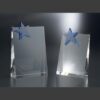 Clear crystal star plaques with beveled edges on a reflective surface, ideal for corporate or employee achievement awards.