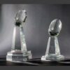 Crystal football trophy award with faceted ball on square bases, ideal for football championship recognition.
