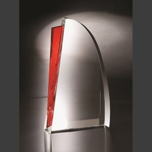 Medium crystal trophy with curved rectangular shape, red accent, on reflective base; ideal for corporate or milestone awards.