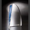 Blue crystal trophy with clear curved surface and blue accent, ideal for corporate recognition or employee achievement awards.