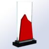 Crystal award trophy with red geometric peak, black base; ideal for corporate recognition or achievement.