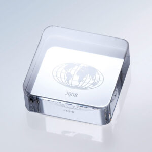 Crystal globe paperweight award, clear glass with etched world design and 2008 engraved, ideal for milestone recognition.